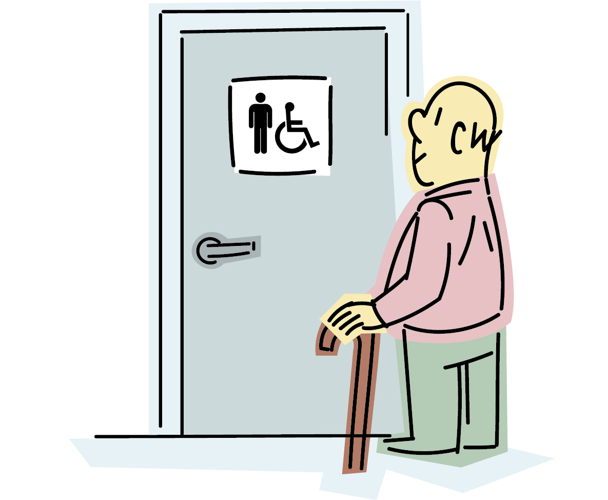 Persona mayor frente a una cabina de aseos señalizada.